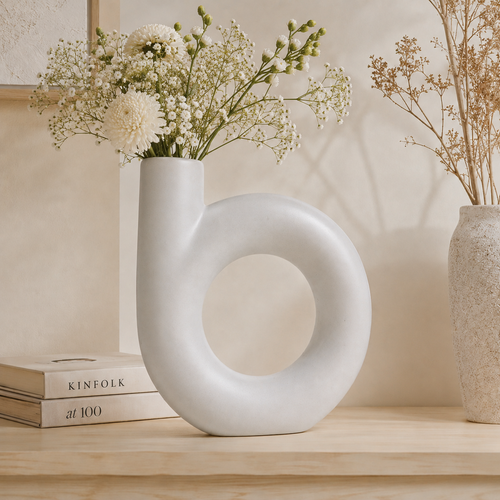 Amira Single Vessel Vase in white ceramic, angled view showing curved vessel opening