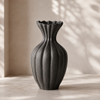 Basma Black Vase in rich black grained unglazed finish with vertical fluting and frilled rim