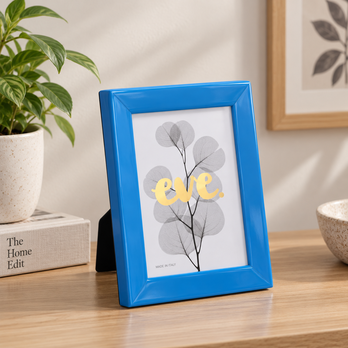 Gelati Blue by Eve photo frame in vibrant blue high-gloss resin, angled view showing rounded profile