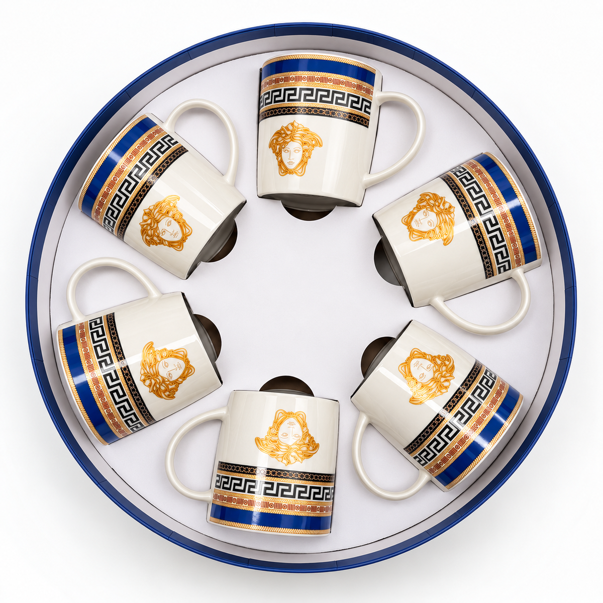 Six white ceramic espresso cups arranged in a circular presentation box, featuring a gold Medusa head logo, blue Greek key patterns, and black decorative bands.