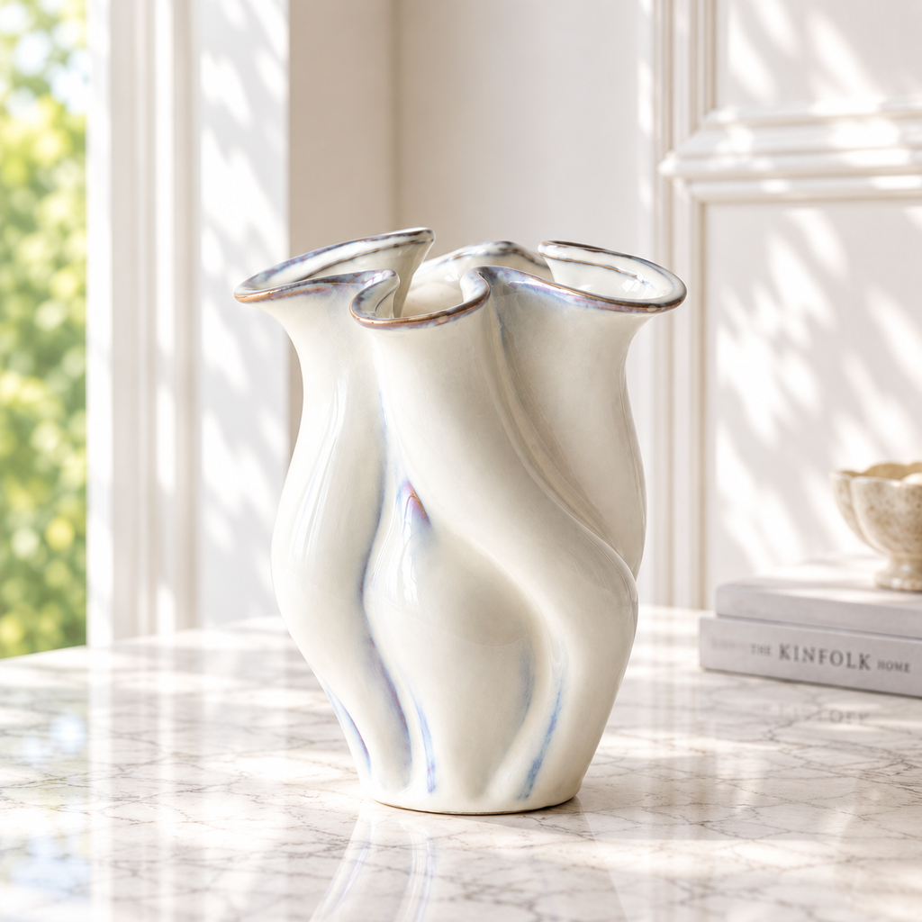 Neva Vase Cloud in white glazed ceramic, side view showing flowing sculptural silhouette
